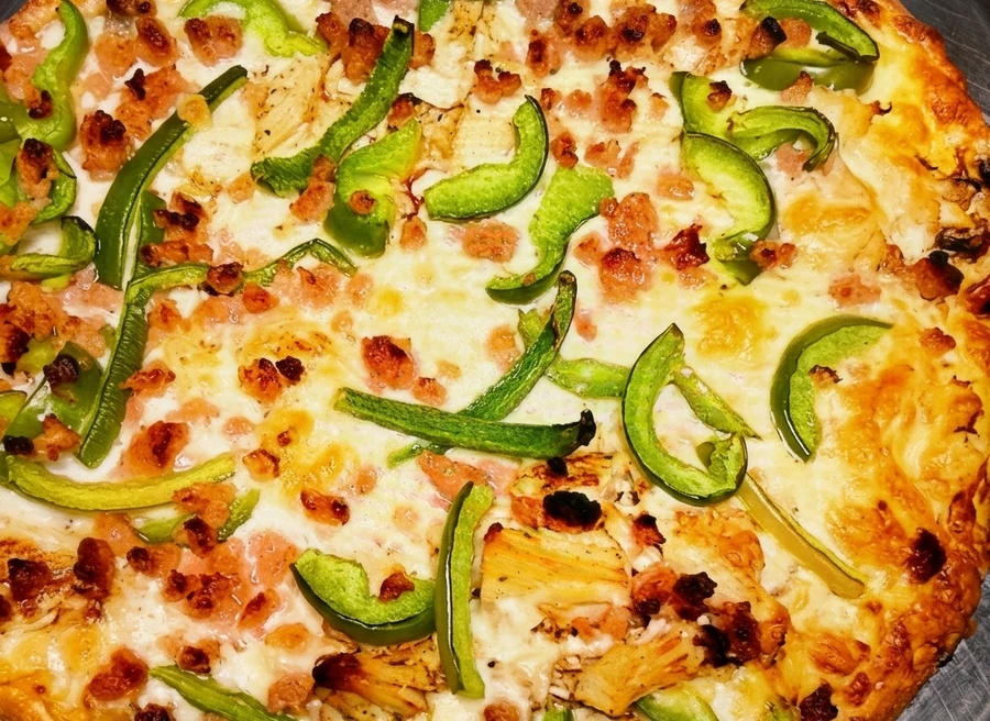 Supreme pizza at Sal's Famous on 82 St Edmonton - loaded with fresh toppings