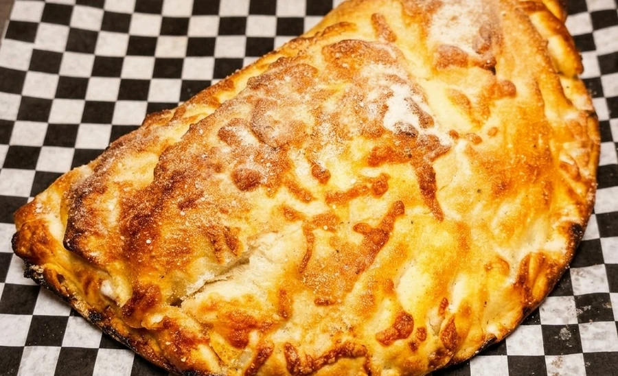 Spinach and feta calzone at Sal's Famous on 82 St Edmonton - Mediterranean-inspired filling